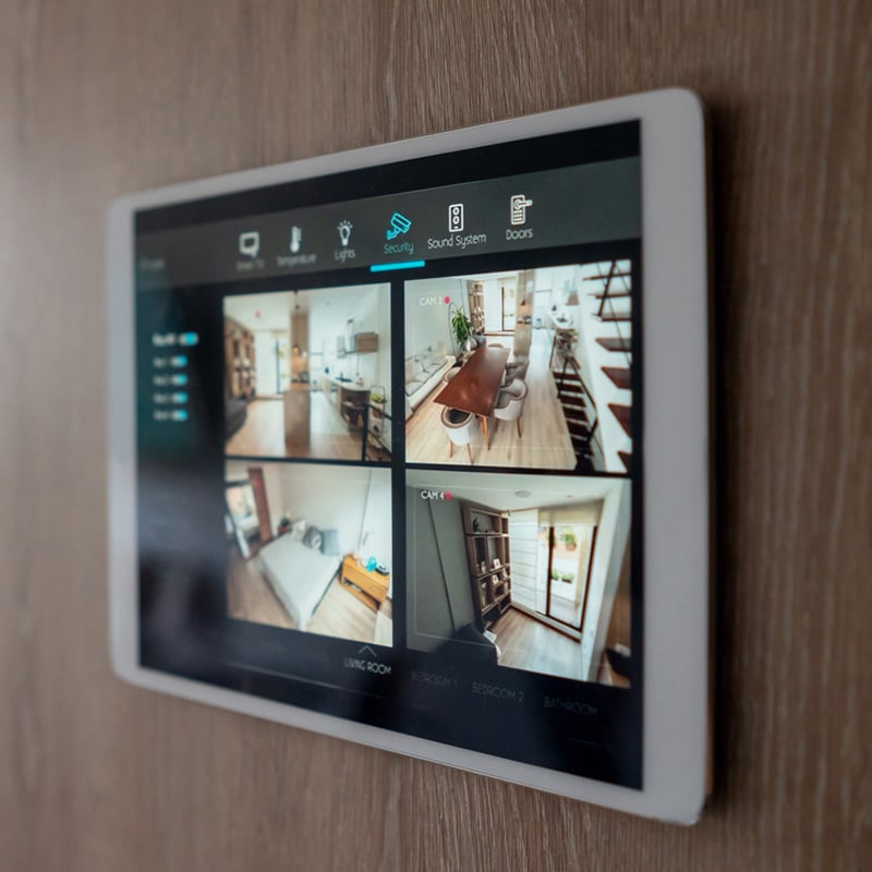 Smart home control panel showing live security camera feeds.