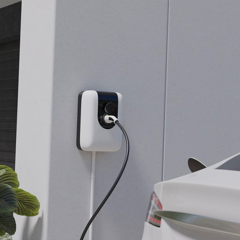 Electric car charging at a home wall-mounted charger, showcasing clean energy and modern technology.